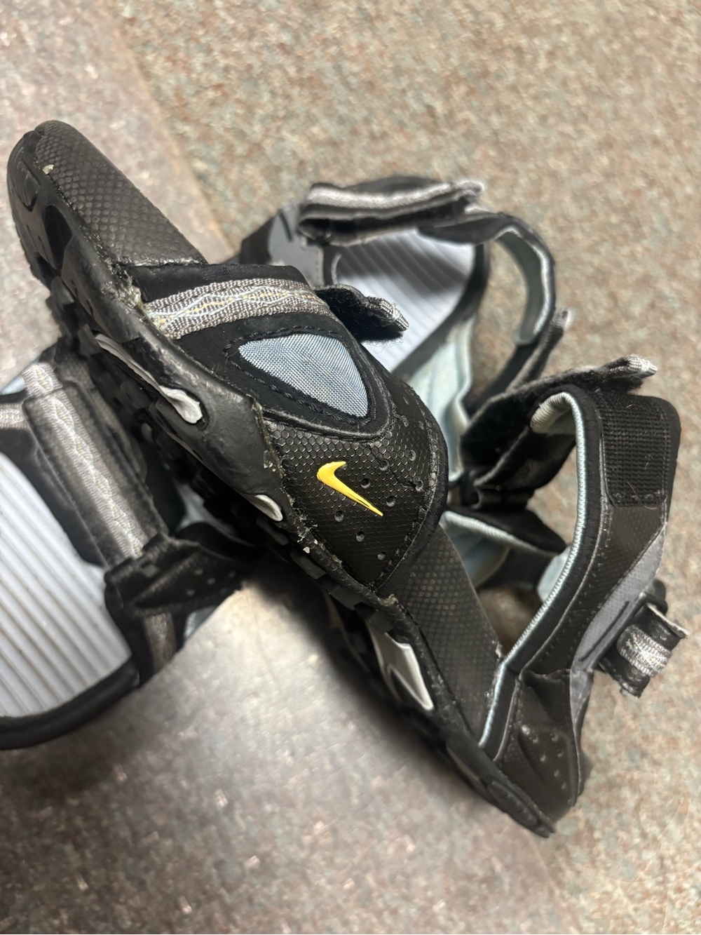 Nike women’s Black and light blue Sandals with Yellow Swoosh